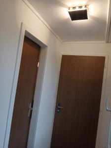 a room with two doors and a ceiling at Zimmer mit Bad in Bühler +4 photos