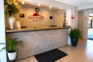 a restaurant with a counter in a building at Santa Fe Motel Tehachapi by Hotel O in Tehachapi