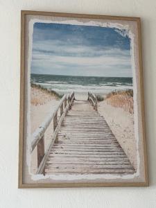 a painting of a wooden boardwalk to the beach at Splendide, FACE MER avec place de parking PRIVEE in Berck-sur-Mer