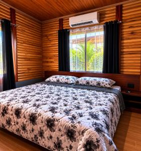 a bedroom with a bed and a window at Cabaña Cadete in San Pedro +10 photos