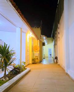 an empty hallway of an office building at night at Home Hostel Maceió in Maceió