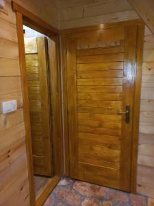 a door to a sauna in a cabin at AJVA Chalet in Žabljak