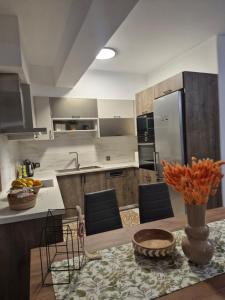 a kitchen with a table with a bowl of food on it at Flaburiotis House in Dhriopís