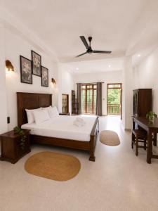 a large bedroom with a bed and a table at AZORA Boutique Studios in Ahangama +35 photos