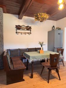 a living room with a table and a couch at Drevenica Kráľova in Šumiac