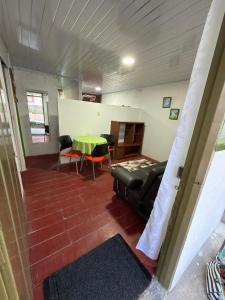 a living room with a couch and a table at El Respiro in Buenavista