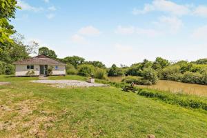 a house in the middle of a field with a park at 2 Bed in Beaworthy oc-87085 in Highampton