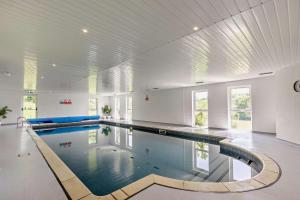 a large swimming pool in a large room at 2 Bed in Beaworthy oc-87085 in Highampton