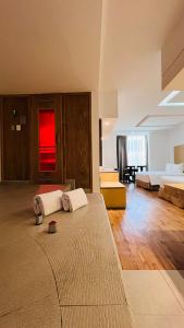 a large room with a bed and a living room at Ramada by Wyndham Mexico City Santa Fe in Mexico City +130 photos