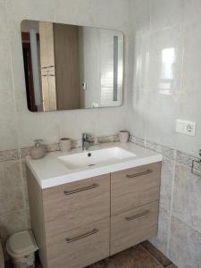 a bathroom with a sink and a mirror at Casa de Cope in Calabardina +26 photos