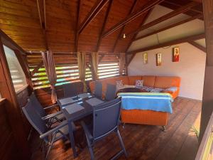 a living room with a couch and a table at Apartmány u tenisového kurtu in Mosty u Jablunkova