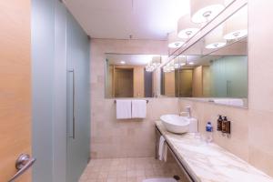 a bathroom with a sink and a mirror at Barceló México Santa Fe in Mexico City