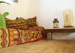a couch sitting in a living room next to a table at La Moderna in La Falda