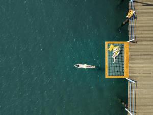 an overhead view of people swimming in the water at Rixos Premium Belek - The Land of Legends Access in Belek