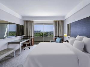 a hotel room with a bed and a desk at Rixos Premium Belek - The Land of Legends Access in Belek +237 photos
