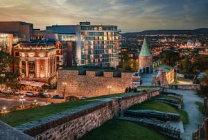a view of a city at night at Le Capitole Hotel in Quebec City