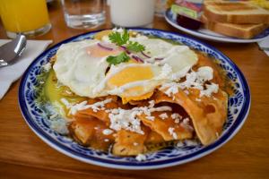 a blue and white plate of food on a table at Suites Gaby Cancun in Cancún