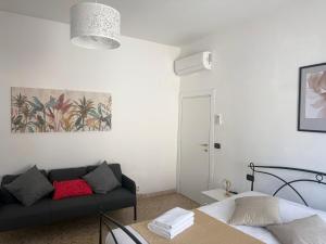 a living room with a couch and a table at Iris Viola in Bagno a Ripoli