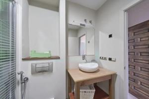 a bathroom with a sink and a mirror at Casa de piedra en el valle a 20 minutos de Ribadeo y Playa de las Catedrales in Salcido +43 photos