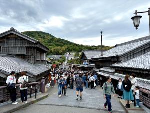 a crowd of people walking down a street in an old town at おかげ参り宿場 in Ise