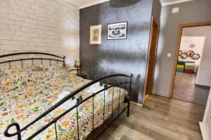 a bedroom with a bed and a brick wall at House Mellifera in Razvođe +30 photos