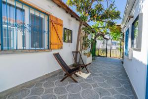 a room with a chair and a window at Nar Suites Alacati in Çeşme