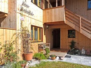 a building with a staircase on the side of it at Haus Wimbachtal in Ramsau