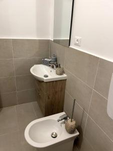 a bathroom with a sink and a mirror at Casa Sciavè - Paradise in Sciacca in Sciacca +30 photos