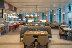 a restaurant with tables and chairs and a bar at The Westin Tampa Bay in Tampa