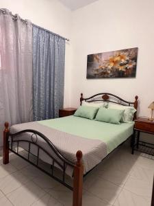 a bedroom with a bed in a room at Casa Tolentino in Bissau