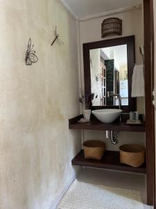 a bathroom with a sink and a mirror at Espaço Aconchego in Pomerode +25 photos