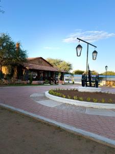 a park with a street light and a building at Villa Rancho el piñón in Ezequiel Montes