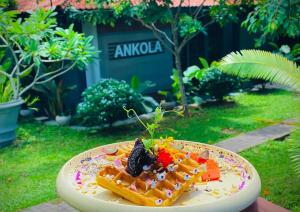 a plate of food on top of a table at Ankola Hotel in Homagama