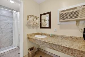 a bathroom with a sink and a shower at Eagle Motel Suite 108 in Manitou Springs