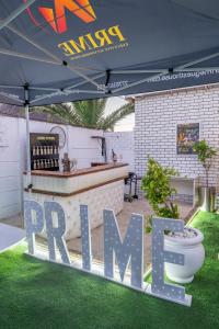 a sign that says dip me under a tent at Self Contained 2 bed Room Condo in Parow
