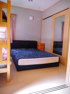 Кровать или кровати в номере Guest House Tomida