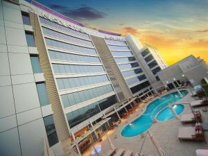 a large hotel with a pool and a resort at Novotel Jazan in Jazan +246 photos
