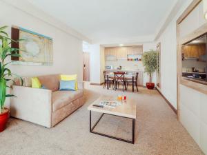 a living room with a couch and a table at ibis Styles Istanbul Bomonti in Istanbul