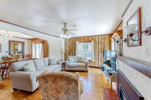 a living room with a couch and a tv at Enchanting Adobe in Lead