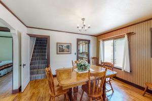 a dining room with a wooden table and chairs at Enchanting Adobe in Lead