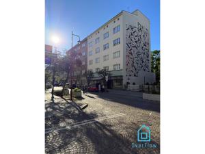 a building with a mural on the side of it at Harbor Room at City Center Gdynia & Seaside in Gdynia