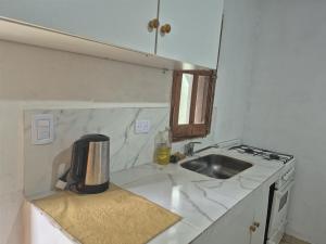 a kitchen with a sink and a counter top at Parque de la Juventud in La Rioja