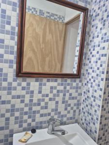 a bathroom with a sink and a mirror at Parque de la Juventud in La Rioja
