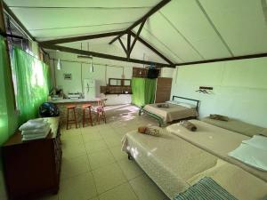 a large room with two beds and a kitchen at Sítio Vivendas in Itaipava +67 photos