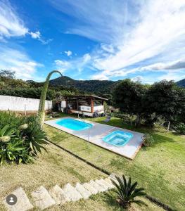an image of a swimming pool in a yard at Sítio Vivendas in Itaipava