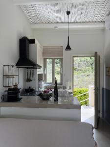 a kitchen with a large island in a room at Casa Horizon in Porto Heli
