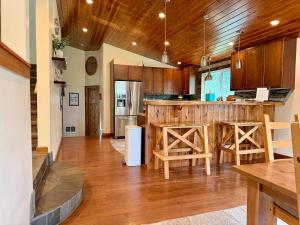 a kitchen with wooden cabinets and a counter top at Bearadise by Casago McCall - Donerightmanagement in McCall