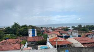 a group of houses with red roofs at Pousada Recanto Bella Vista in Saubara