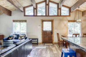 a living room with a couch and a table at Northstar Cabin Escape in Truckee