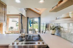 a kitchen with a stove and a counter top at Lakeview Meadow Retreat in Sisters